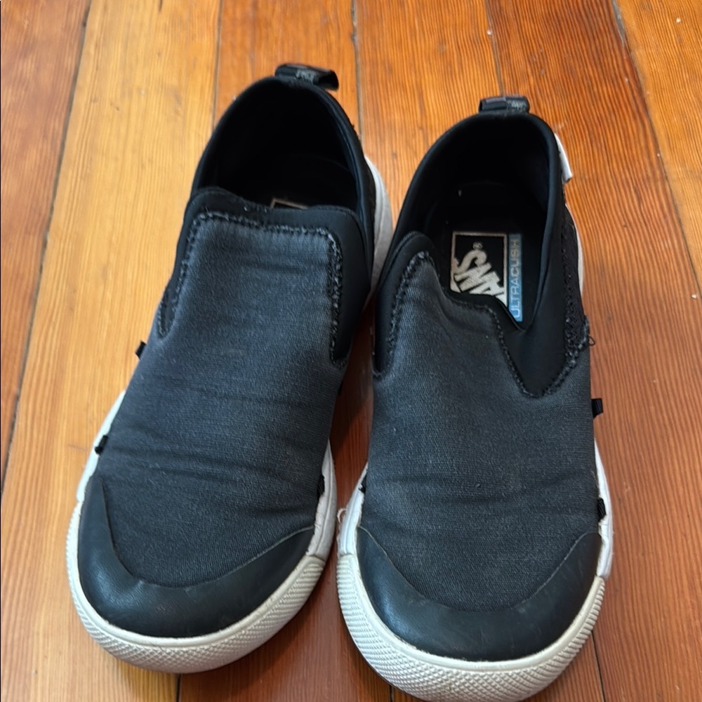 Vans Black and White Canvas Slip-On Sneakers